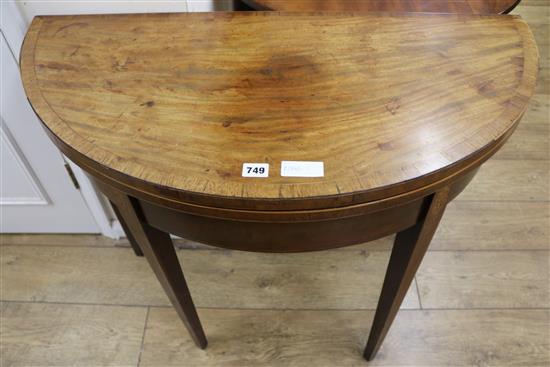 A mahogany demi-lune inlaid tea table, W.92cm